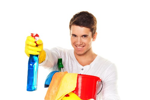 Staff member wearing PPE during professional carpet cleaning
